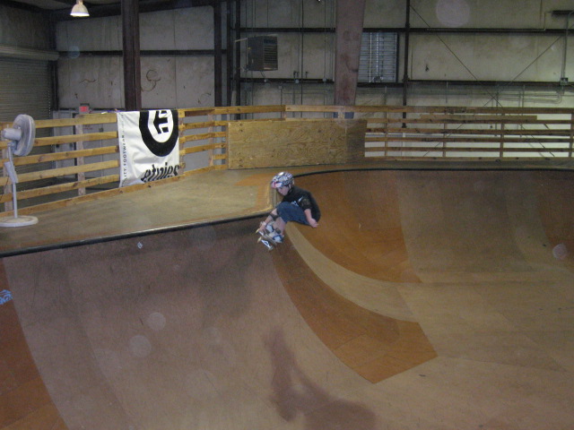 Little local ripper Lance learns frontside grabs over the hip